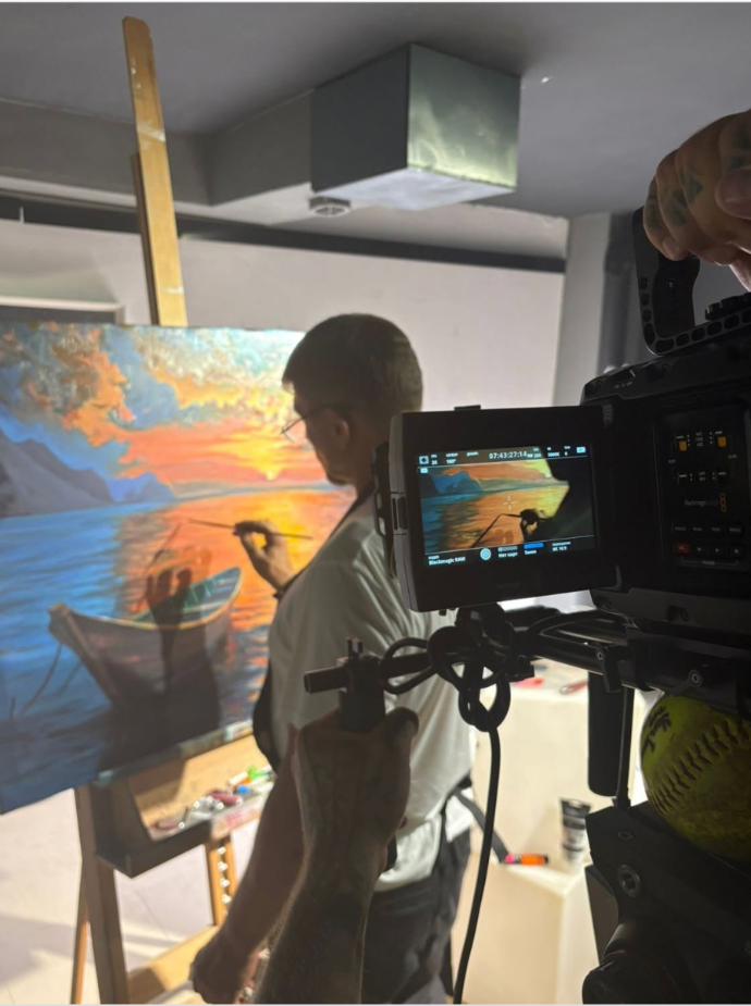 Artist Yevhen Sudin creating artwork on the set of the movie Island with Kevin McNally